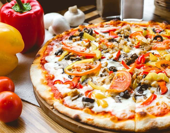 mix-pizza-chicken-tomato-bell-pepper-olives-mushroom-side-view_141793-3167